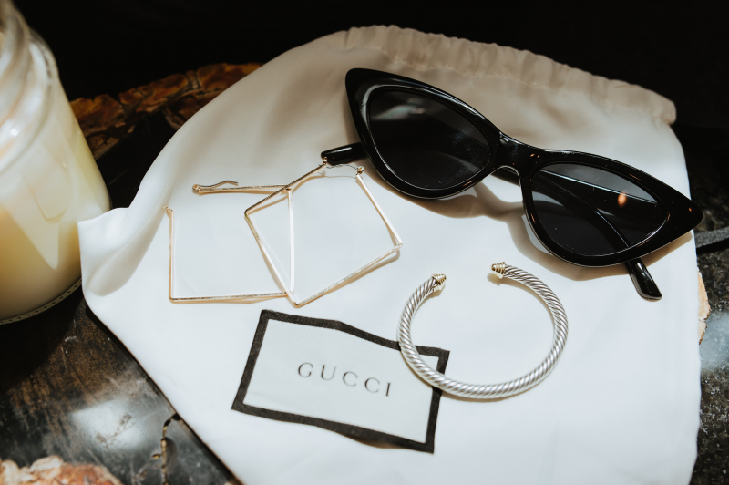 Photo by Katelyn Whitson: https://www.pexels.com/photo/black-framed-sunglasses-and-jewelries-on-a-gucci-dust-bag-12901704/