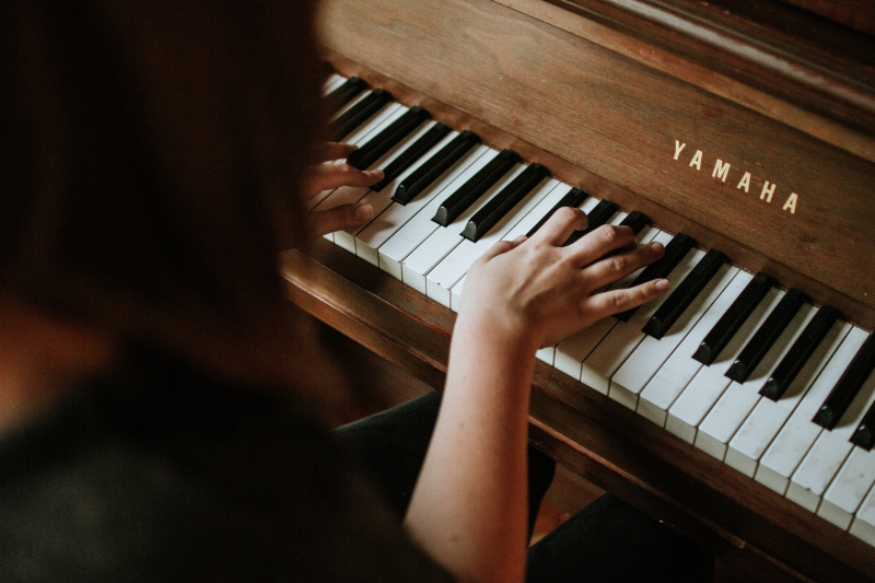 Photo by Jordan Whitfield on Unsplash: https://unsplash.com/photos/woman-playing-yamaha-piano-BhfE1IgcsA8