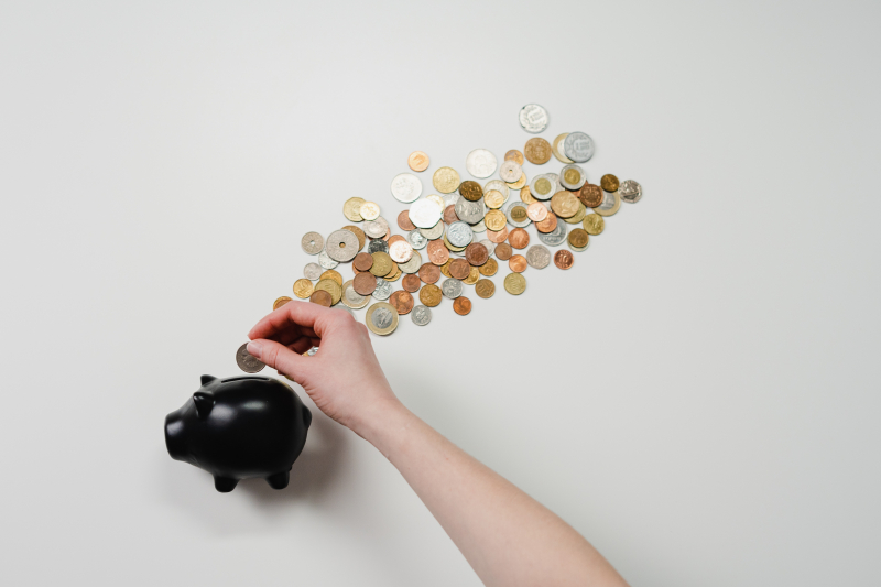 Photo by cottonbro studio: https://www.pexels.com/photo/person-putting-coin-in-a-piggy-bank-3943716/