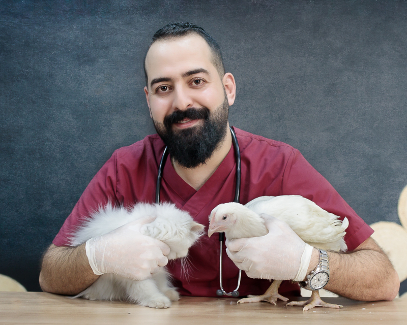 Photo by Bilal Izaddin: https://www.pexels.com/photo/a-man-in-red-shirt-holding-a-cat-and-a-chicken-10559203/