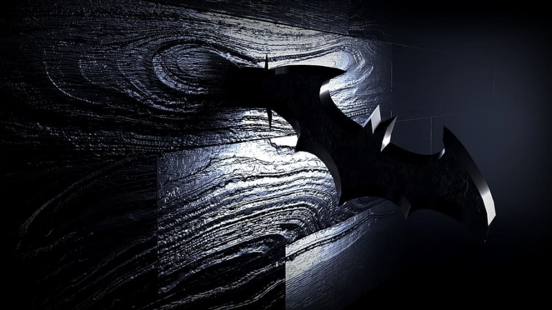 Photo on Wallpaper Flare: https://www.wallpaperflare.com/batman-logo-shaped-blade-on-brown-wooden-surface-dark-black-wallpaper-ukkba