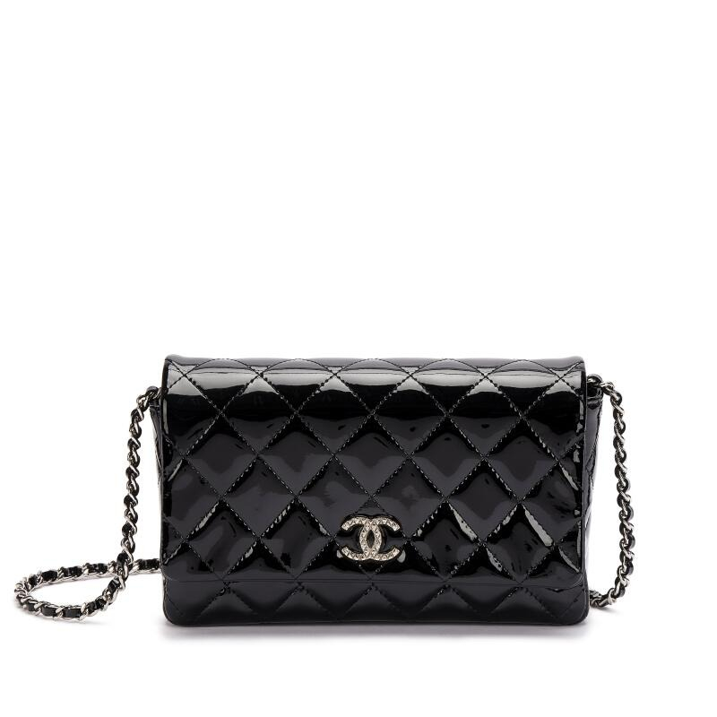 Screenshot of https://www.sothebys.com/en/buy/_Chanel-Black-Quilted-Patent-Wallet-on-Chain-Silver-Hardware-2009-201006f