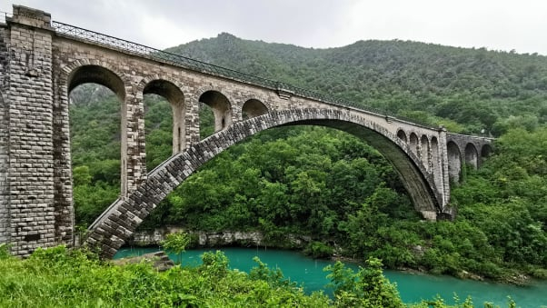 The Bohinj line slices through Slovenia, and takes you over the world's largest stone railway bridge - DragoNika/Adobe Stock