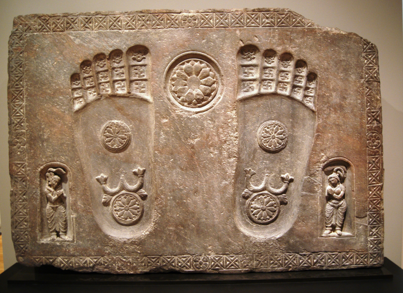 Photo by https://commons.wikimedia.org/wiki/File:Footprints_of_the_Buddha_%282nd_century,_Yale_University_Art_Gallery%29.jpg