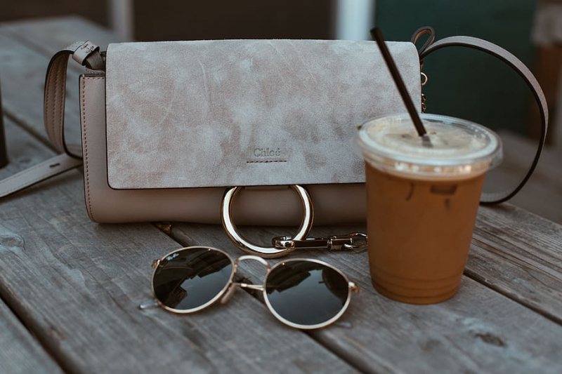 Photo on  Wallpaper Flare (https://www.wallpaperflare.com/leather-crossbody-bag-beside-drink-and-sunglasses-accessory-wallpaper-adyml)