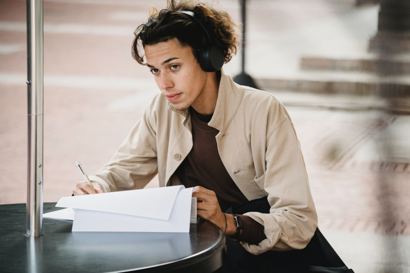 Photo by Armin  Rimoldi: https://www.pexels.com/photo/thoughtful-man-writing-in-papers-while-doing-homework-5554266/