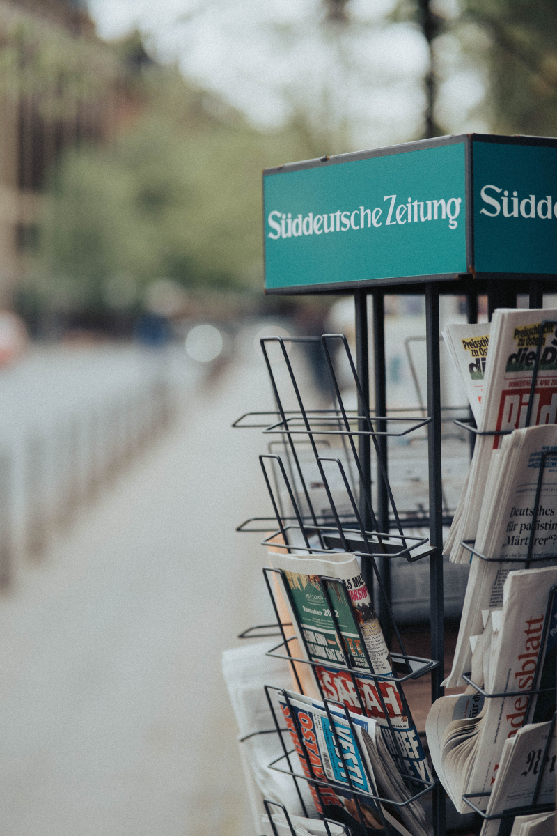 Photo by Benni Fish: https://www.pexels.com/photo/display-rack-with-newspapers-on-street-12418421/