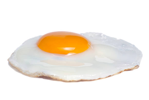 Cook sunny-side-up eggs in a covered pan