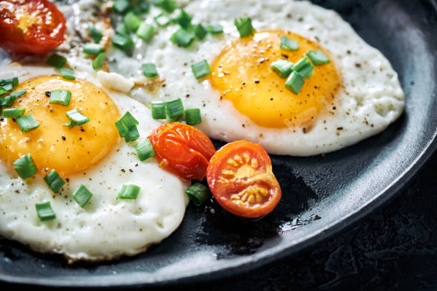 Cook sunny-side-up eggs in a covered pan