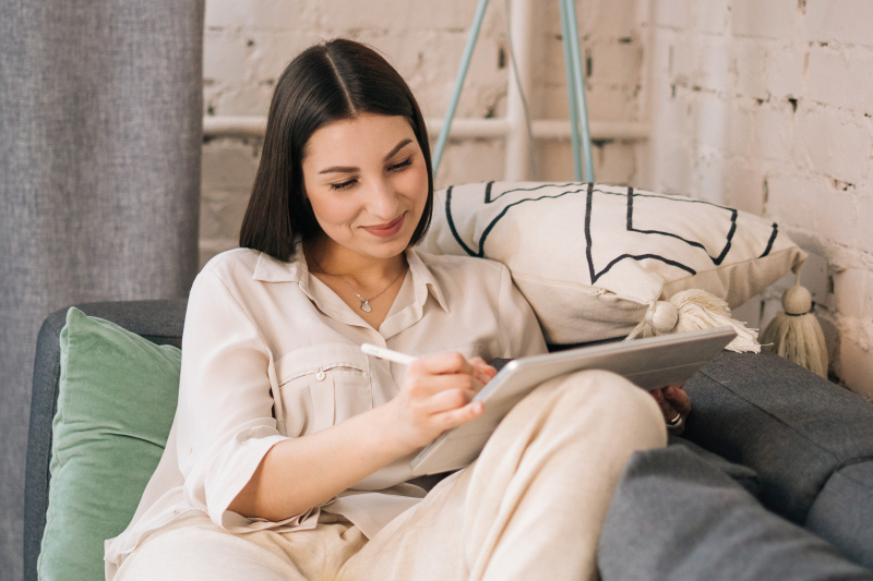 Photo by  Tima Miroshnichenko on Pexels (https://www.pexels.com/photo/a-woman-using-a-tablet-while-sitting-on-gray-sofa-4963062/)