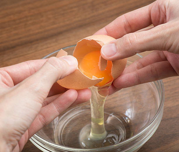 Crack eggs on a flat surface and into a separate bowl