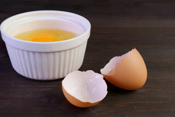 Wet your fingers to remove pesky egg shells
