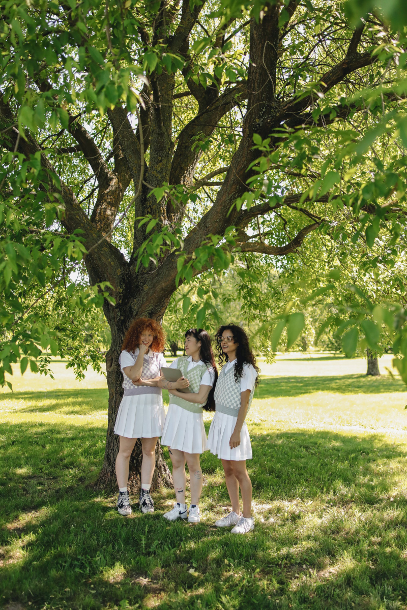 Photo by Polina Tankilevitch: https://www.pexels.com/photo/a-group-of-girls-in-white-skirt-standing-near-the-tree-8217159/