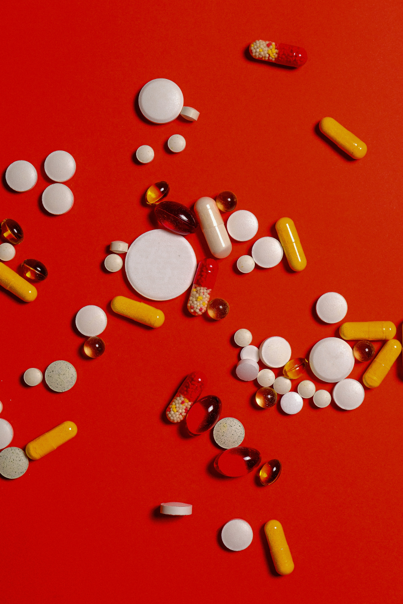 Photo by Anna Shvets on Pexels: https://www.pexels.com/photo/different-medication-pills-and-capsules-on-red-background-3683040/