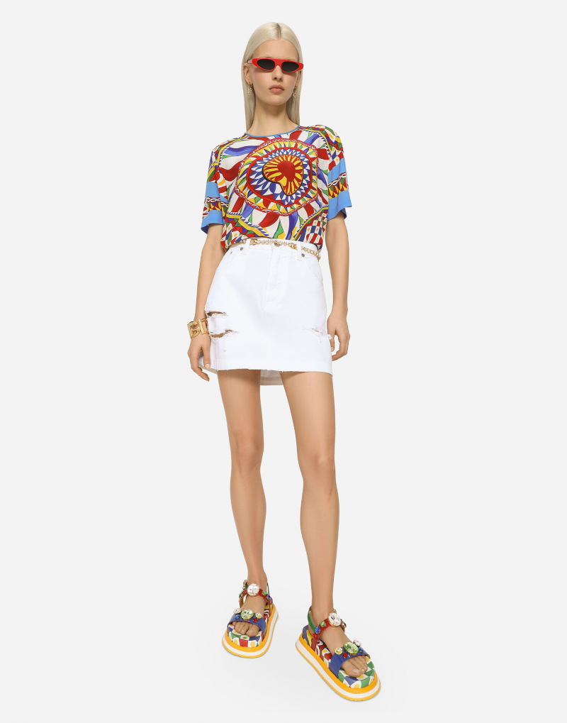 Screenshot of https://www.dolcegabbana.com/en/fashion/women/clothing/denim/denim-mini-skirt-with-rips-multicolor-F4CPKDG8JQ6S9001.html