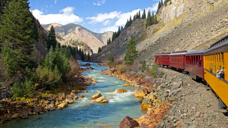 Durango and Silverton Narrow Gauge Railroad traveling along the Animas River from Durango to Silverton with some of Colorado's striking canyon scenery in San Juan Mountains. ROZANNE HAKALA/GETTY IMAGES
