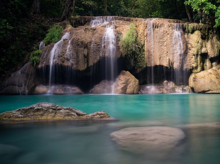 One of the lower pools of the Erawan Falls and probably the most popular one for swimming. - Pinterest
