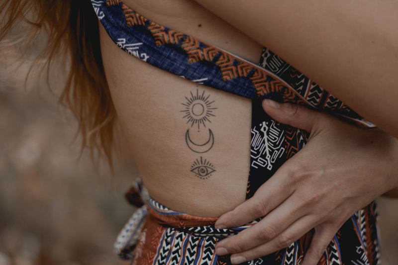 Photo by Content Pixie on Unsplash: https://unsplash.com/photos/woman-with-floral-tattoo-on-her-right-arm-bLWaYQlfaZ0