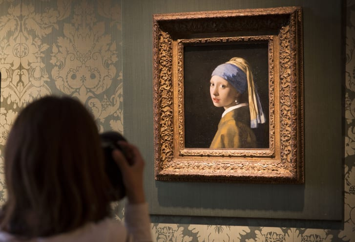 A journalist takes a photo of Johannes Vermeer's 