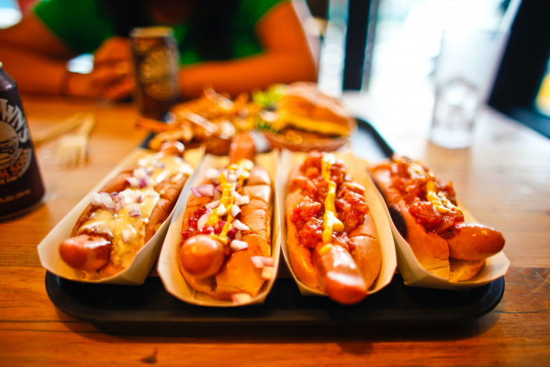 Photo by https://www.pexels.com/photo/close-up-photo-of-hot-dog-on-sandwiches-3023479/