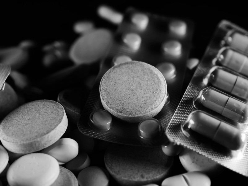 Photo by Rūdolfs Klintsons on Pexels: https://www.pexels.com/photo/grayscale-photo-of-medicines-and-drugs-7380393/