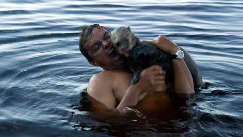 Photo:  Outside Magazine - a man catches sea otter
