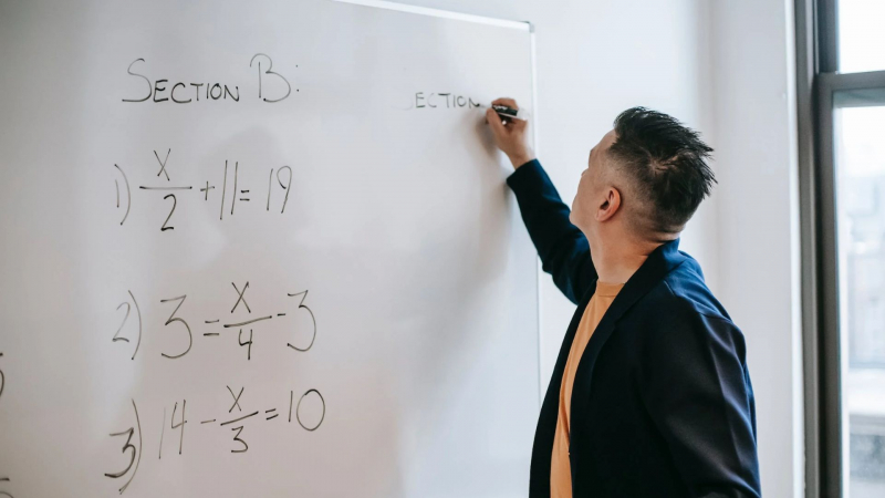 Photo by Vanessa Garcia on Pexels https://www.pexels.com/photo/focused-worker-writing-equations-on-whiteboard-in-office-in-daytime-6325967/