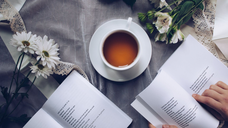 Photo by Thought Catalog on Pexels https://www.pexels.com/photo/white-ceramic-teacup-with-saucer-near-two-books-above-gray-floral-textile-904616/