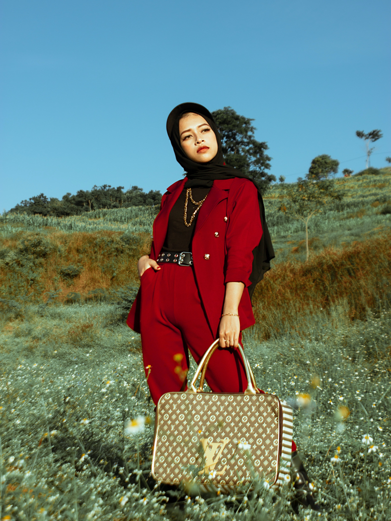 Photo by Hazby Assidiqi Rochman: https://www.pexels.com/photo/a-woman-in-red-blazer-and-pants-holding-a-louis-vuitton-bag-5806571/