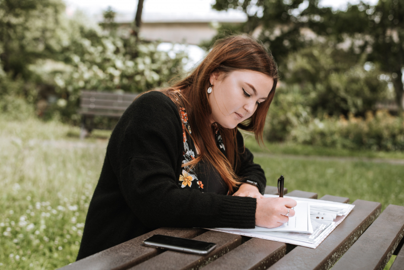 Photo by Anete Lusina: https://www.pexels.com/photo/concentrated-woman-writing-notes-in-papers-in-park-4792255/