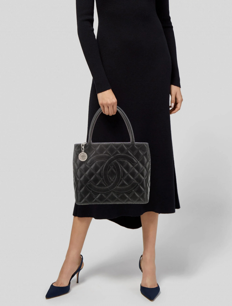 Screenshot of https://www.therealreal.com/products/women/handbags/totes/chanel-caviar-medallion-tote-ilzxf