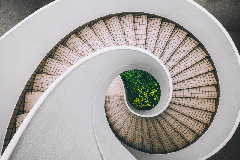 Photo by Dan Freeman on Unsplash: https://unsplash.com/photos/white-and-brown-concrete-spiral-stairs-WHPsxhB4mWQ