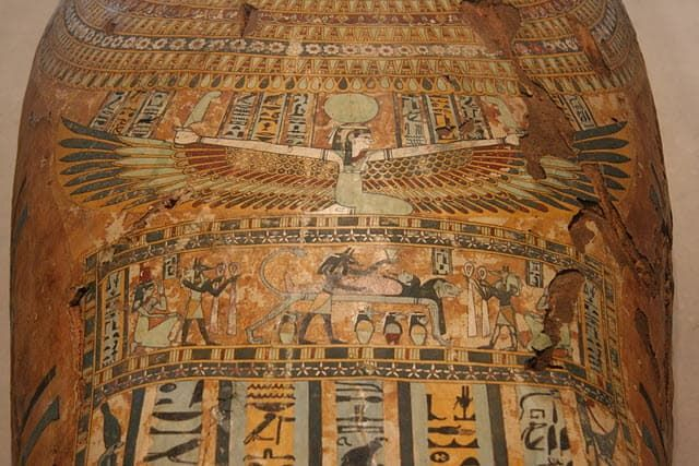 A portrait of the Egyptian Goddess with her wings spread around the coffin