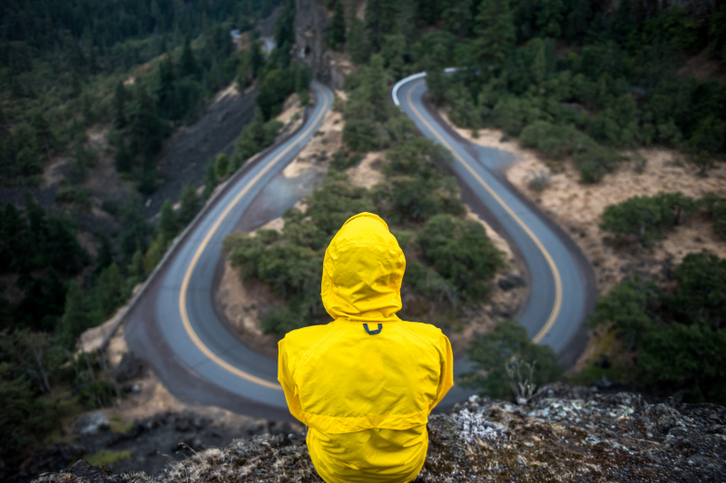 Photo by Justin Luebke on Unsplash: https://unsplash.com/photos/person-in-yellow-coat-standing-on-top-of-hill-BkkVcWUgwEk