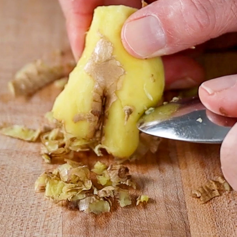 Peel ginger by scraping it