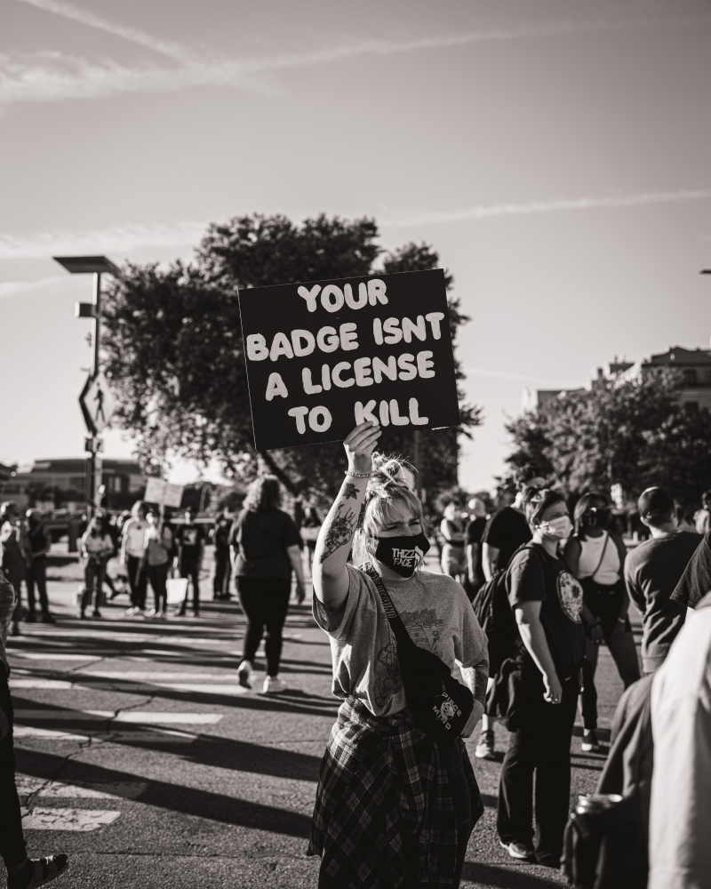 Photo by Lee chinyama: https://www.pexels.com/photo/black-and-white-photo-of-police-brutality-protest-9748196/