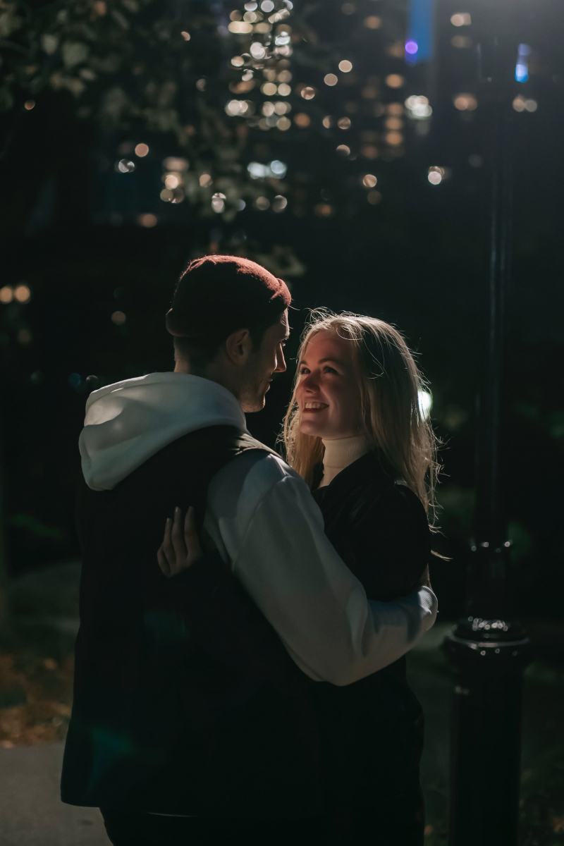 Photo by Katerina Holmes: https://www.pexels.com/photo/cheerful-couple-hugging-in-park-in-darkness-5911018/