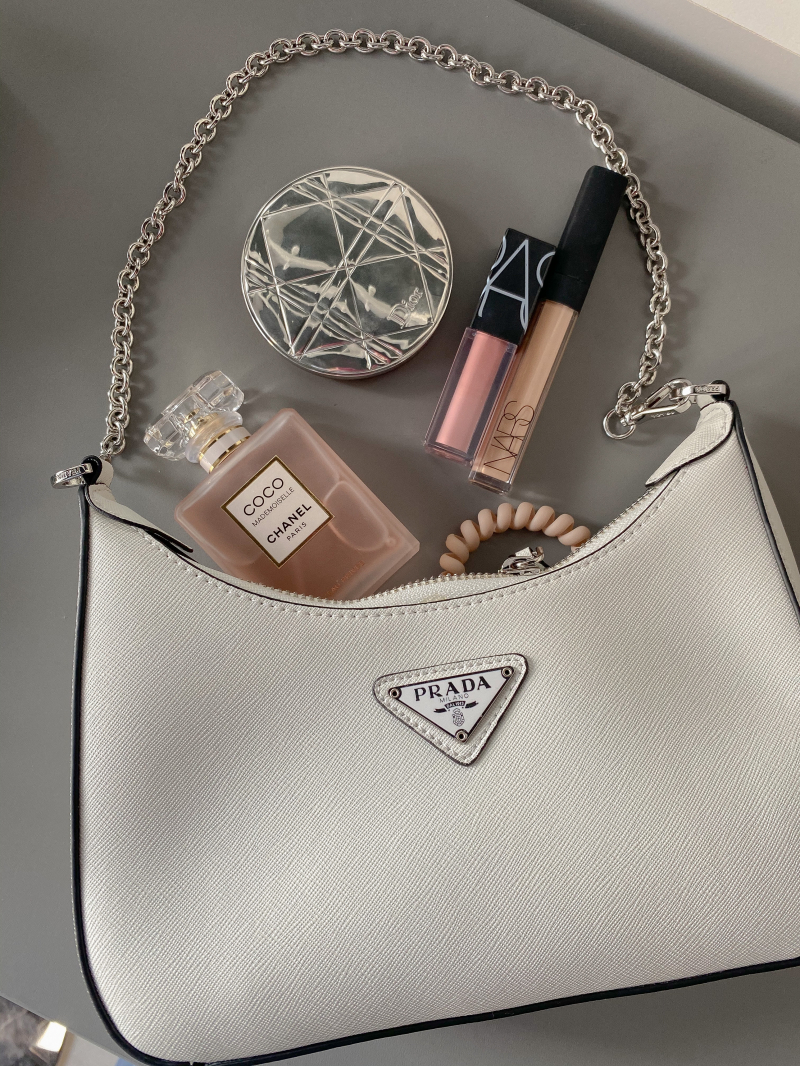 Photo by Анастасия : https://www.pexels.com/photo/flatlay-shot-of-a-bag-with-makeup-and-perfume-8365688/
