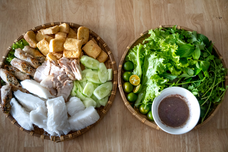Photo by https://www.pexels.com/photo/delicious-vietnamese-dish-with-fried-tofu-noodles-and-mixed-leaves-5116817/