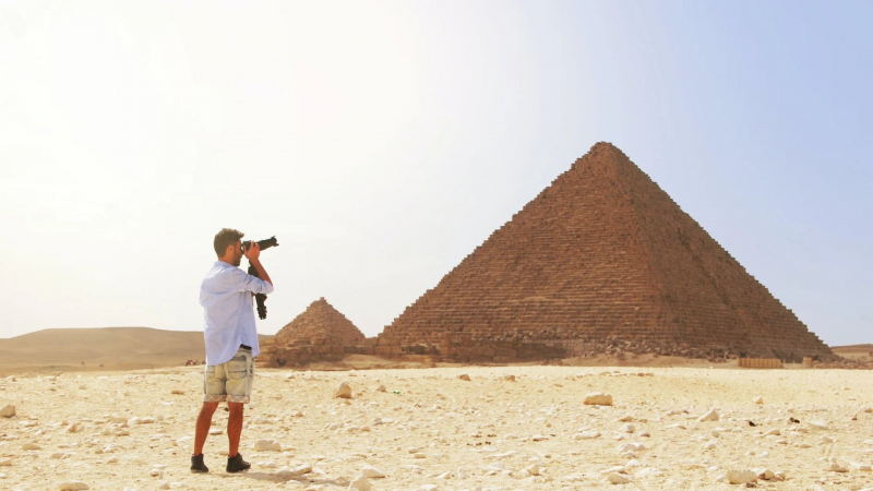 Photo by The World Hopper on Pexels https://www.pexels.com/photo/man-taking-photo-of-the-great-pyramid-1851481/