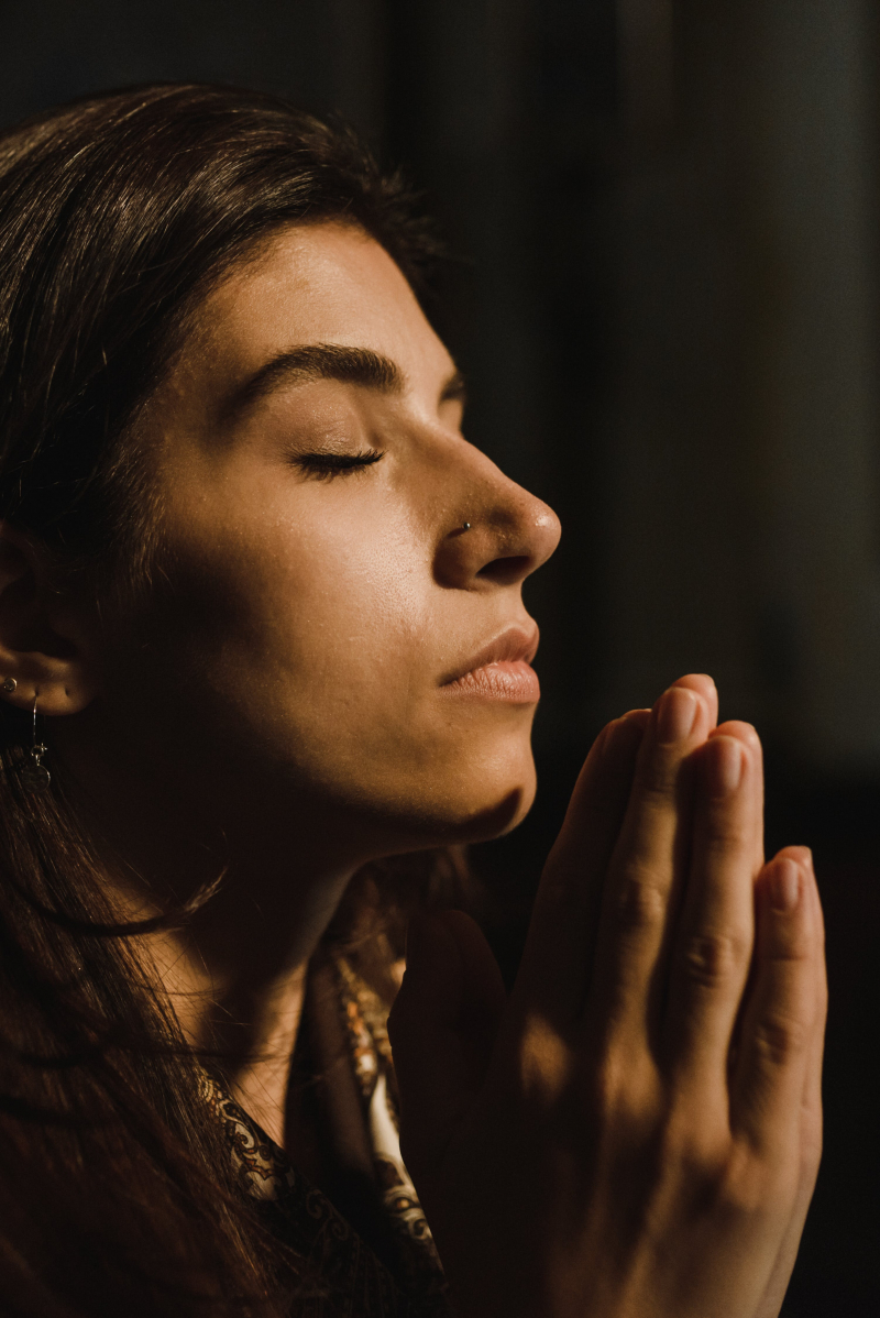 Photo by Arina Krasnikova: https://www.pexels.com/photo/close-up-shot-of-a-woman-praying-5418308/