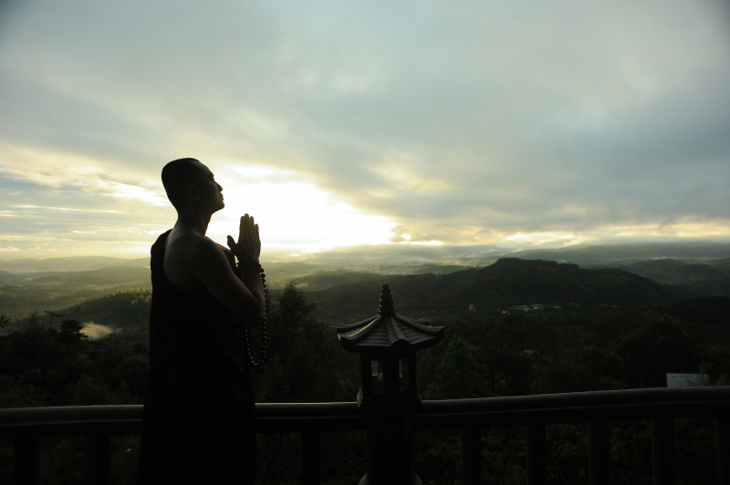 Photo by THÁI NHÀN: https://www.pexels.com/photo/monk-holding-prayer-beads-across-mountain-2730217/