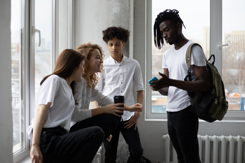Photo by Monstera Production: https://www.pexels.com/photo/young-diverse-students-chatting-near-window-6238169/