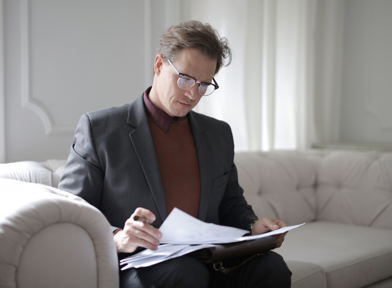 Photo by Andrea Piacquadio: https://www.pexels.com/photo/classy-executive-male-reading-papers-on-couch-3760514/