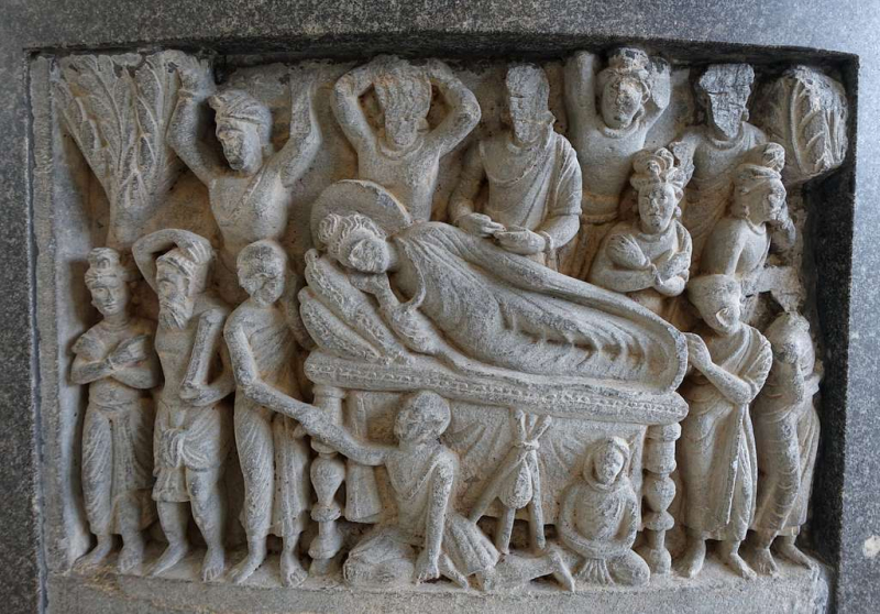 Photo on Wikimedia Commons (https://picryl.com/media/death-of-the-buddha-pakistan-kushan-period-200s-ad-stone-hakone-museum-of-art-8fbf1f)