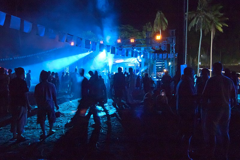 Photon on Wiki: https://commons.wikimedia.org/wiki/File:Night_party_on_the_beach,_lights,_Koh_Chang,_Thailand.jpg