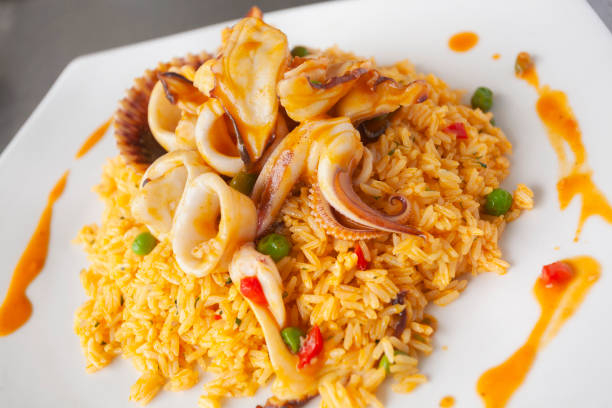 Top (or fill) rice with seafood