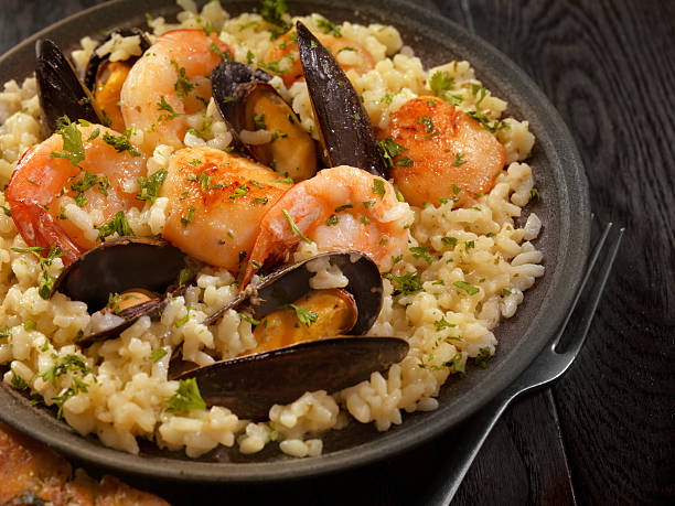 Top (or fill) rice with seafood