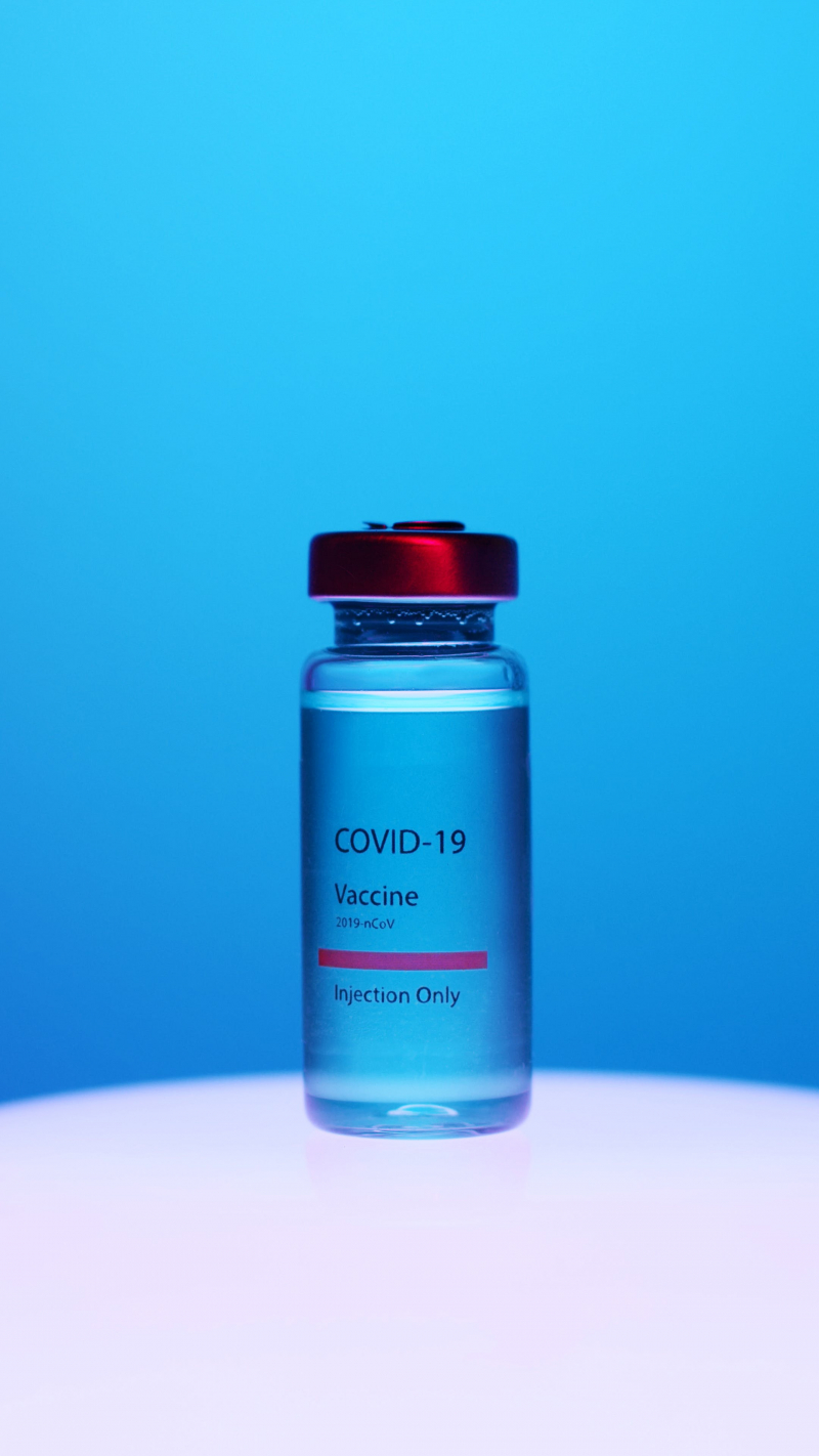 Photo by Artem Podrez: https://www.pexels.com/photo/a-close-up-view-of-a-covid-19-vaccine-vial-on-blue-background-5878503/