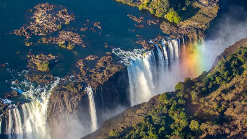 Victoria Falls is on the border of Zimbabwe and Zambia. Torsten Reuter/Shutterstock